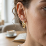 Solitaire Diamond Loop Huggie Earrings in yellow gold with sculpted layered hoop